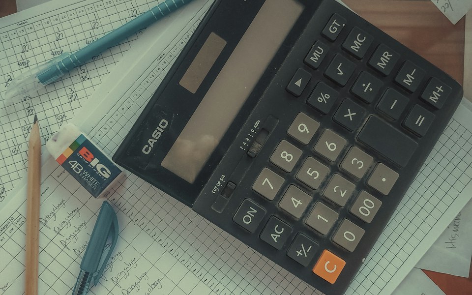 Calculator on top of accounting records